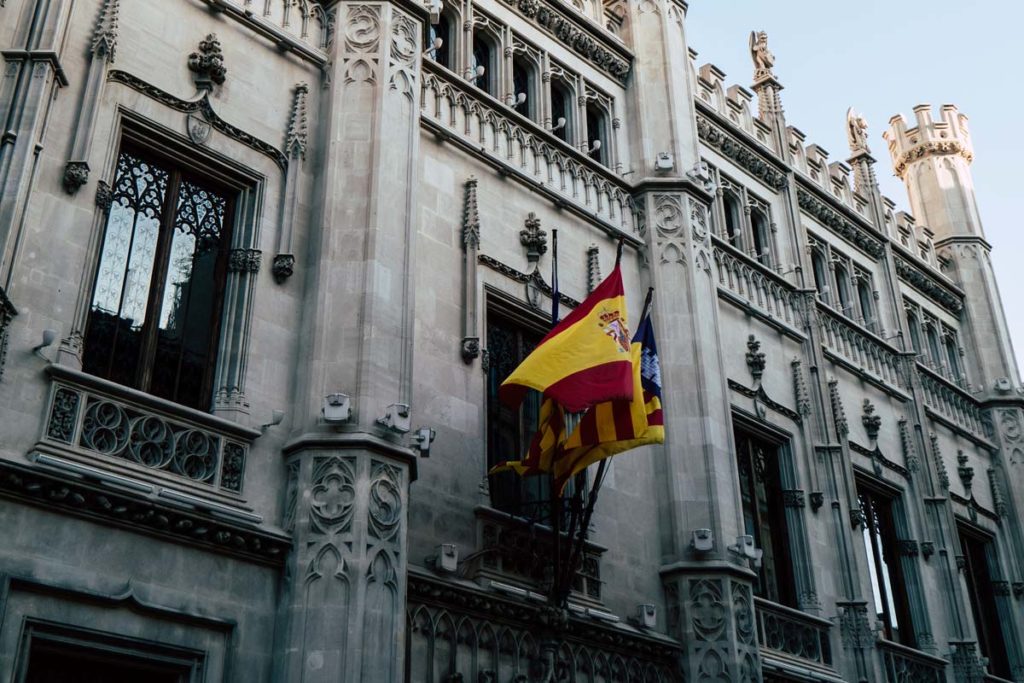 spanish flag over a government office.